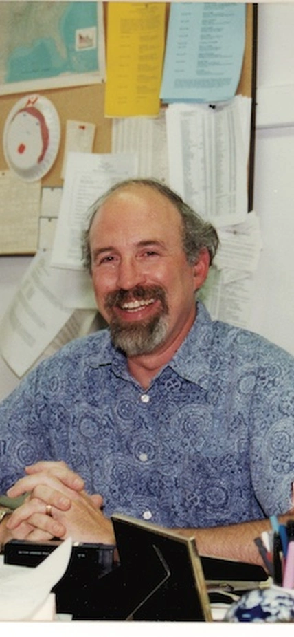 The late Paul Silver smiles from behind his desk at the Carnegie Institution for Science Broad Branch Road Campus. The Carnegie Institution for Science recently introduced a new named postdoctoral fellowship in his honor. Image courtesy of Carnegie Institution for Science.