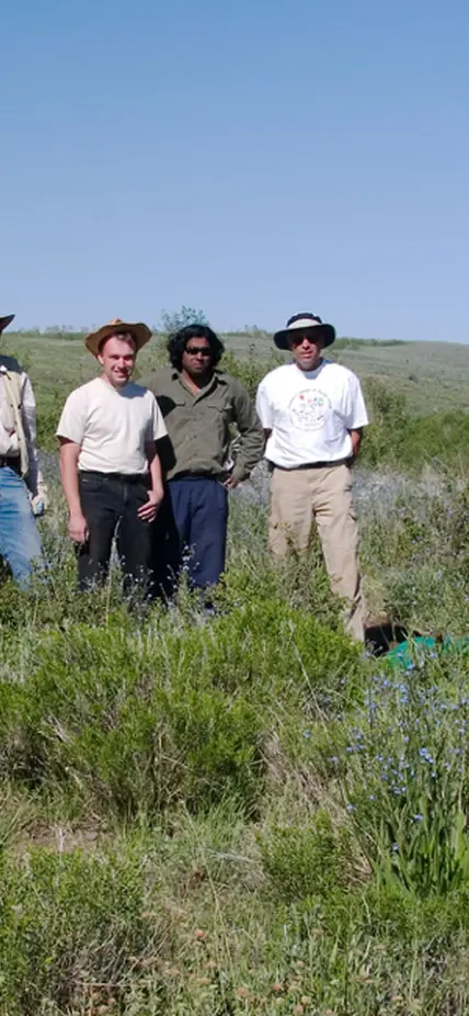 David James, Steven Golden, Shaji Nair, and John West (l to r) pose next to an installed seismometer station in Oregon for the High Lava Plains project in 2006. 