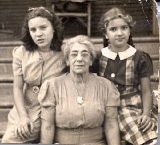 Vera (right) and her sister Ruth (left) with their grandmother.