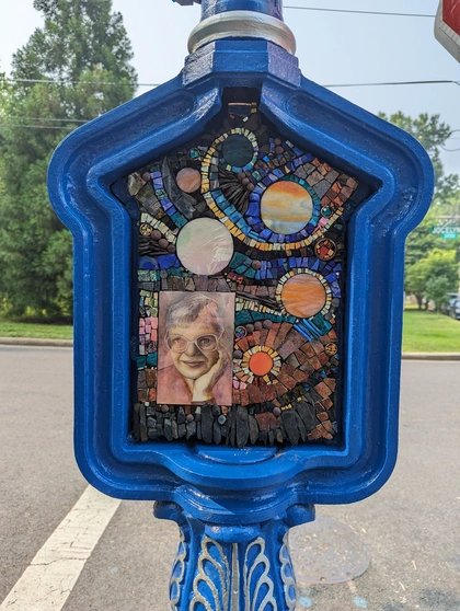 Call Box Art - Brightly colored mosaic with space themes and a portrait of Vera Rubin
