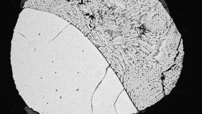 A back-scattered electron image showing one of the products of Chabot’s lab at APL mimicry of the core crystallization process. Liquid metal is on the right and solid metal is on the left. Image is courtesy of Nancy Chabot and Peng Ni.