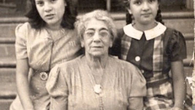 Vera (right) and her sister Ruth (left) with their grandmother.