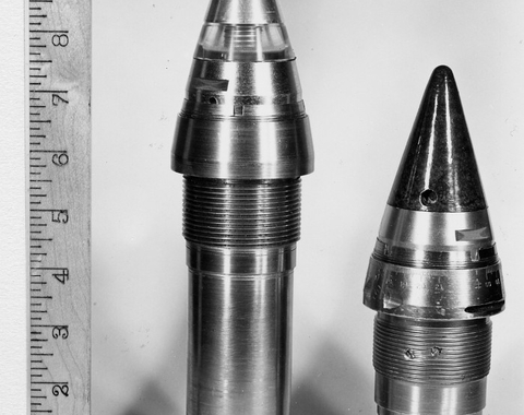 A proximity fuze at the left compared with a clockwork fuze at right
