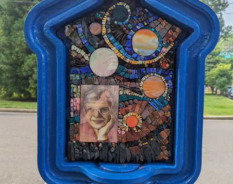 Call Box Art - Brightly colored mosaic with space themes and a portrait of Vera Rubin
