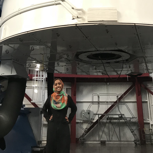 Munazza Alam stands in front of the Magellan Clay telescope at Carnegie's Las Campanas Observatory. Image courtesy Munazza Alam.